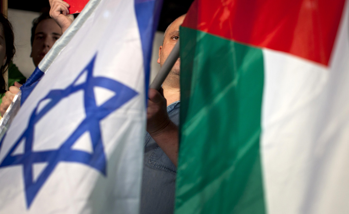 
ChatGPT
ChatGPT
The image depicts a person partially obscured by two national flags, one being the flag of Israel, characterized by its blue Star of David on a white background with blue stripes near the top and bottom, and the other being the flag of Palestine, with its black, white, green, and red stripes.